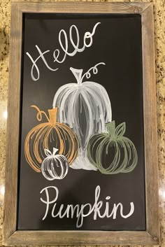 a chalkboard sign that says hello to pumpkin