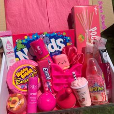 a pink box filled with lots of different items