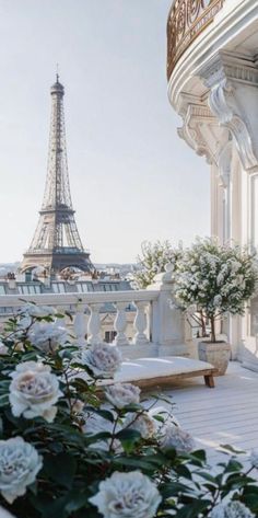 the view of the eiffel tower from an apartment balcony