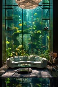 a living room filled with lots of green plants and fish swimming in the water below