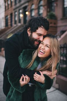 a man hugging a woman on the street