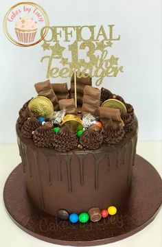 a birthday cake with chocolate frosting and candies