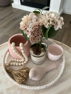 a table with flowers and other items on it