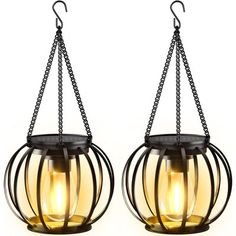 two hanging lights with chains attached to them on a white background, one is yellow and the other is black