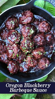 a skillet filled with meatballs covered in barbecue sauce