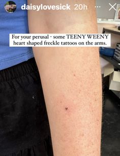 a person with a tattoo on their arm that says, for your persue some tenny weey heart shaped freckle tattoos on the arms