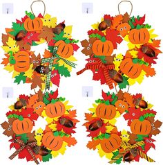 two wreaths with fall leaves and acorns on them, each decorated in different colors