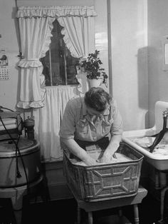 a man is washing his hands in the sink