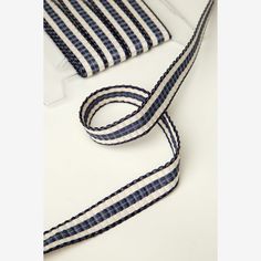 a blue and white striped bag strap