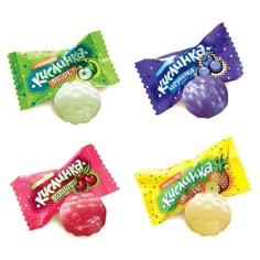 four different types of candy on a white background