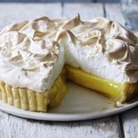 a lemon meringue pie on a white plate