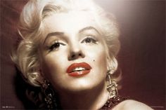 marilyn monroe wearing red lipstick and earrings