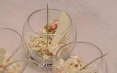 four glasses filled with food on top of a table