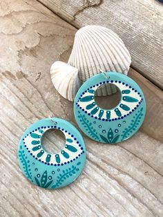 "These have all the beach feels for me ! Handpainted in soft greens and teal's . These Wood earrings measure 2\" in diameter . Painted with acrylics and sealed with a Non- yellowing gloss varnish to protect the artwork ." Hand Painted Bohemian Earrings For Everyday, Unique Hand-painted Jewelry For Beach, Mdf Earrings Hand Painted, Trendy Green Hand-painted Earrings, Wooden Handpainted Earrings, Painted Jewelry, Hand Painted Jewelry, Jewellery Ideas