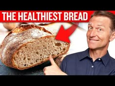 a man pointing to a loaf of bread on top of a cutting board with the words, the healthiest bread