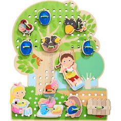 an image of a wooden toy tree with children's pictures on it and magnets attached to the tree