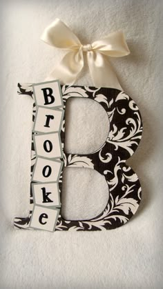 the letter b is decorated with black and white fabric