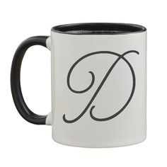 a black and white coffee mug with the letter g on it