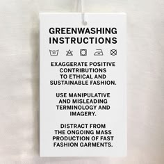 a white sign hanging from the side of a wall that says greenwashing instructions