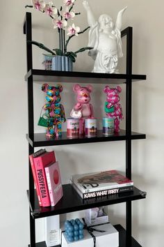 a black shelf with various items on it