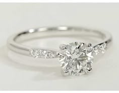 a white gold engagement ring with diamonds on it