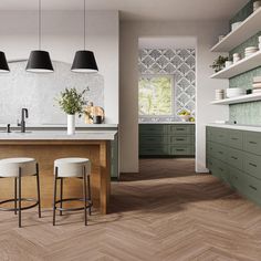 a kitchen with green cabinets and white counter tops, two stools at the island