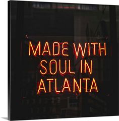 a neon sign with the words made with soul in atlanta on it's side