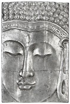 the face of a buddha statue is shown in black and white