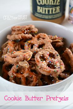 cookie butter pretzels in a white bowl with sprinkles on top