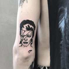 a person with a tattoo on their arm