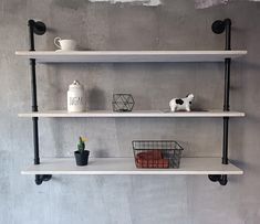 three white shelves with various items on them