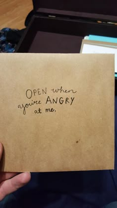 an open envelope with writing on it in someone's hand that says, open when you're angry at me