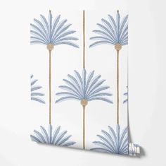 blue and white wallpaper with palm trees on the side, against a white background