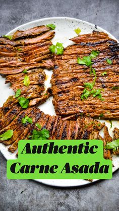 grilled steaks on a plate with garnishes and parsley sprigs