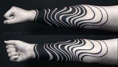 the arm is covered with black and white lines, which are drawn on both sides