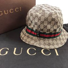 Authentic Gucci Bucket Hat, Gg Monogrammed Brown Canvas Leather, Iconic Red And Green Ribbons Detail, Silver Logo Hardware,,Very Good Condition, Comes With Dust Bag Gucci Bucket Hat, Large Hats, Silver Logo, Green Ribbon, Gucci Accessories, Brown Canvas, Canvas Leather, Bucket Hat, Dust Bag