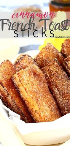 french toast sticks in a white bowl with sugar on top and the words, cinnamon french toaststicks