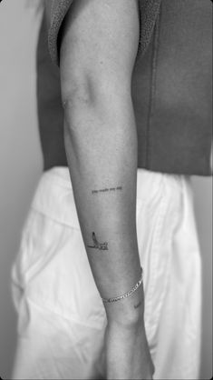 a woman with a small tattoo on her arm