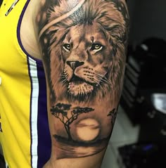 a man with a lion tattoo on his arm