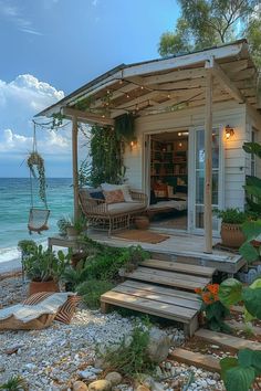 a house on the beach with some plants