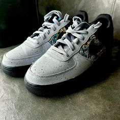 Enhance Your Kid's Sneaker Collection With These Stylish Nike Air Force 1 Low Lv8 Gs Sneakers. Designed With Synthetic Leather Upper Material And Rubber Outsole Material, These Lace-Up Sneakers Offer A Standard Shoe Width And Are Perfect For Athletic Activities. The Grey Colorway Features Graffiti Graphics That Make These Shoes Stand Out From The Rest. These Nwot Sneakers Are In Great Shape And Were Manufactured In 2020 In Vietnam. The Nike Brand Is Well-Known For Its Quality And Durability, Mak Gray Custom Sneakers For Streetwear, Nike Gray Low-top Sneakers, Gray Low-top Skate Shoes With Laces, Gray Low-top Skate Shoes, Gray Custom Sneakers With Air Max Cushioning For Sports, Nike Gray Urban Sneakers, Low-top Running Shoes With Speckled Midsole For Streetwear, Nike Air Force 1 With Speckled Midsole For Streetwear, Urban Gray Low-top Custom Sneakers