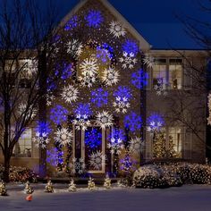 a house decorated with christmas lights and snowflakes