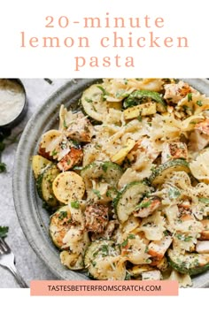 a bowl filled with lemon chicken pasta and topped with parmesan cheese