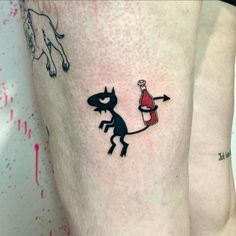 two tattoos on the legs of people with red and black ink, one is holding a bottle