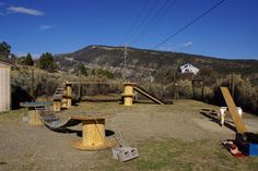 there are several wooden structures in the field