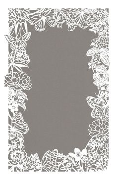 a white frame with flowers and butterflies in it on a gray background for an ornament