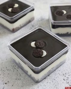 three desserts in plastic containers with oreo cookies on top