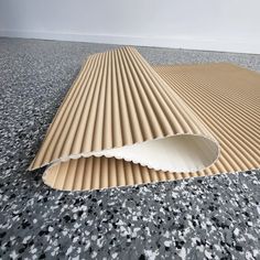 an image of a floor that is made out of corrugated paper and has a hole in the middle