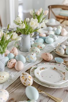 the table is set with eggs and flowers