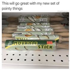 several rolls of moving stick sitting on top of a shelf